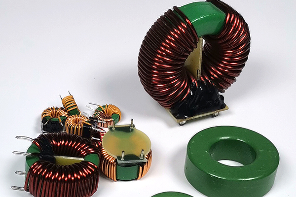 The influence of magnetic core materials on the performance of ring transformers